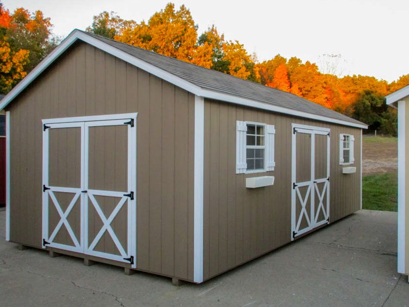 Gray A-frame storage shed with double doors and windows