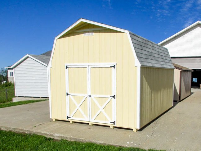 Gambrel barn with double doors and contrasting white trim