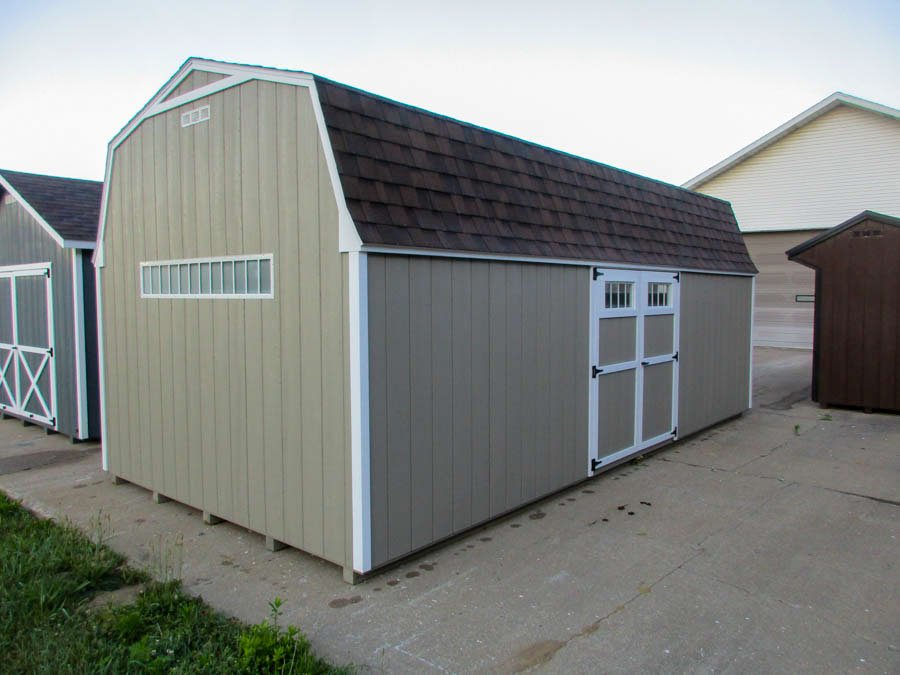 Custom Gambrel barn displayed on a grassy property