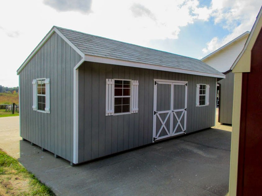 Quaker barn with offset roofline, double doors, and windows