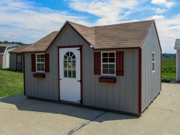 Victorian storage shed with contrasting trim and windows